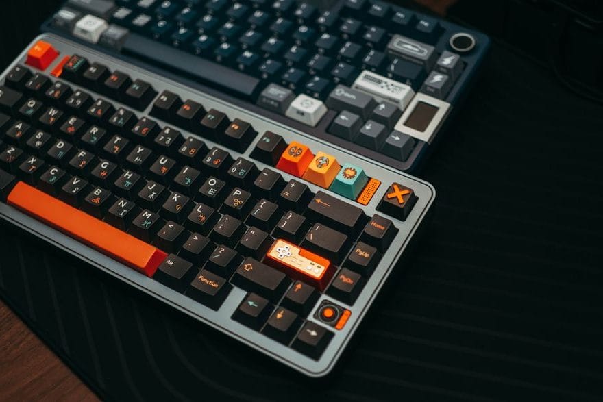 Close-up of a mechanical keyboard with PBT keycaps on a wooden desk